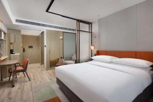 Imagen de la habitación del Hotel Home2 Suite By Hilton Wuxi Huishan. Foto 11