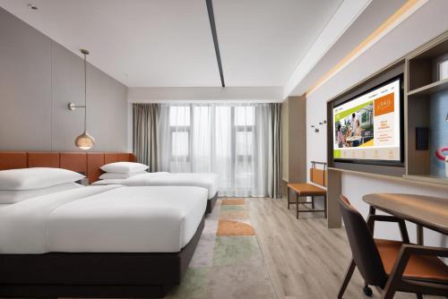 Imagen de la habitación del Hotel Home2 Suite By Hilton Wuxi Huishan. Foto 12