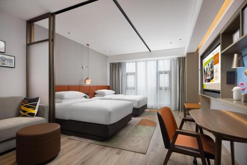 Imagen de la habitación del Hotel Home2 Suite By Hilton Wuxi Huishan. Foto 13