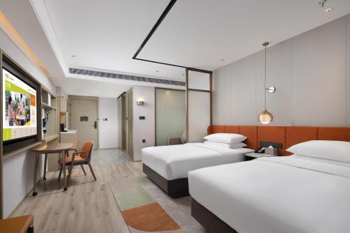Imagen de la habitación del Hotel Home2 Suite By Hilton Wuxi Huishan. Foto 14