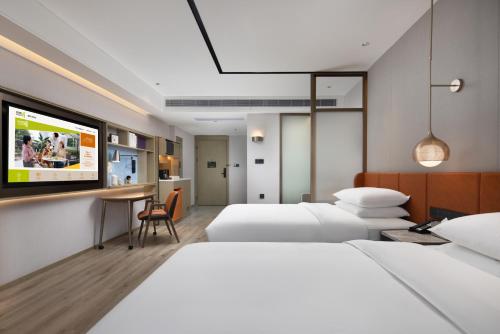 Imagen de la habitación del Hotel Home2 Suite By Hilton Wuxi Huishan. Foto 17
