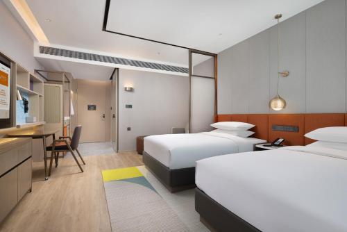 Imagen de la habitación del Hotel Home2 Suite by Hilton Chengdu Huaizhou New Town. Foto 17