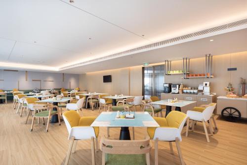 Imagen del bar/restaurante del Hotel Home2 Suite by Hilton Guangzhou Conghua. Foto 10