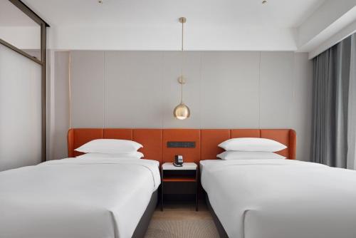 Imagen de la habitación del Hotel Home2 Suite by Hilton Guiyang Nanming Jiaxiu. Foto 16