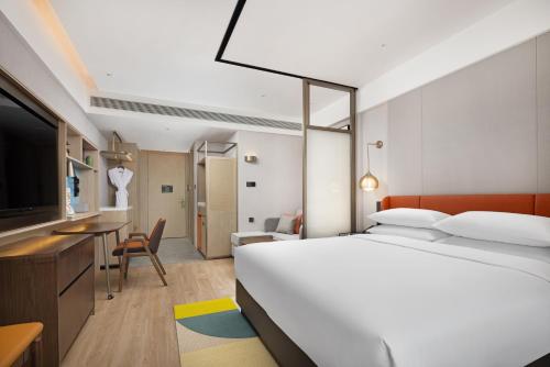 Imagen de la habitación del Hotel Home2 Suite by Hilton Guiyang Nanming Jiaxiu. Foto 18