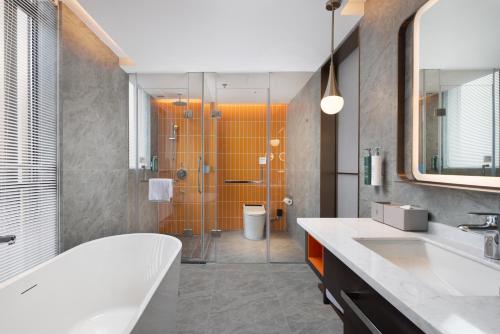 Imagen de la habitación del Hotel Home2 Suite by Hilton Guiyang Nanming Jiaxiu. Foto 19