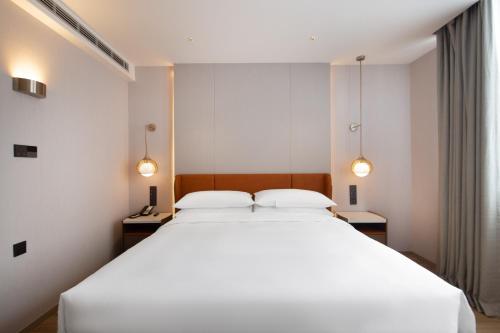 Imagen de la habitación del Hotel Home2 Suite by Hilton Hangzhou Qianjiang New Town. Foto 10