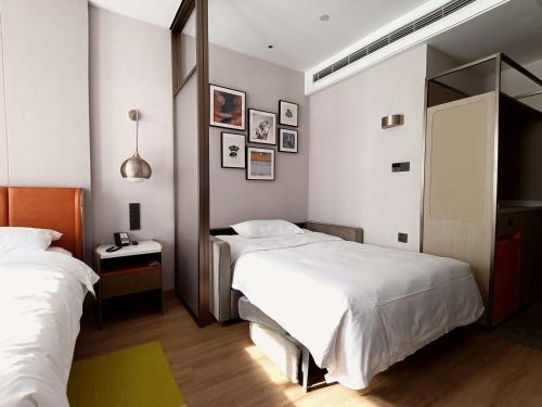 Imagen de la habitación del Hotel Home2 Suite by Hilton Hangzhou Qianjiang New Town. Foto 12