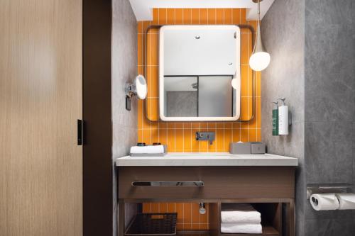 Imagen de la habitación del Hotel Home2 Suite by Hilton Harbin Central Street. Foto 15