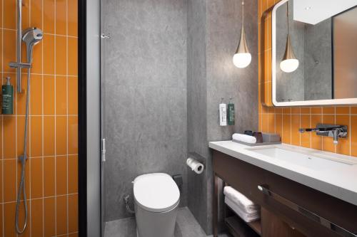 Imagen de la habitación del Hotel Home2 Suite by Hilton Harbin Central Street. Foto 16