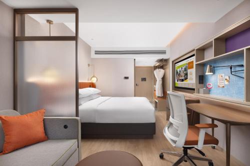 Imagen de la habitación del Hotel Home2 Suite by Hilton Harbin Central Street. Foto 17