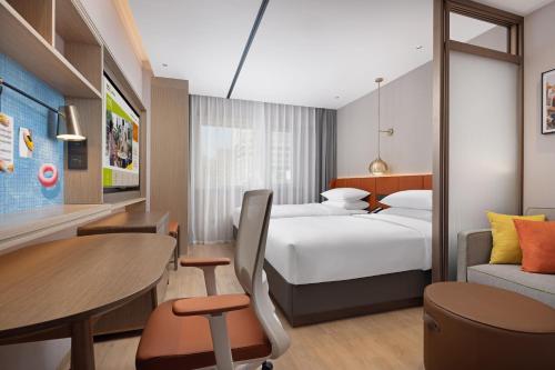 Imagen de la habitación del Hotel Home2 Suite by Hilton Harbin Central Street. Foto 18