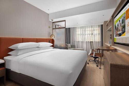 Imagen de la habitación del Hotel Home2 Suite by Hilton Harbin Central Street. Foto 19