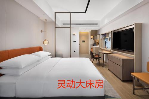 Imagen de la habitación del Hotel Home2 Suite by Hilton Jinan Tangye. Foto 15