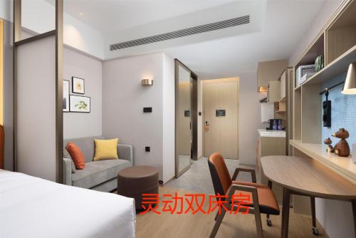 Imagen de la habitación del Hotel Home2 Suite by Hilton Jinan Tangye. Foto 16
