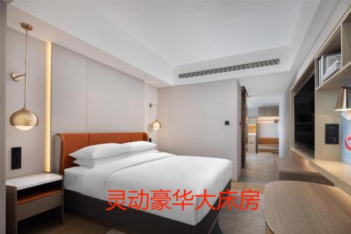 Imagen de la habitación del Hotel Home2 Suite by Hilton Jinan Tangye. Foto 17
