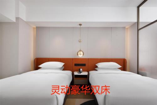Imagen de la habitación del Hotel Home2 Suite by Hilton Jinan Tangye. Foto 18