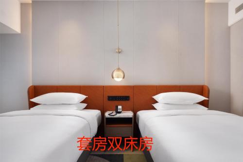 Imagen de la habitación del Hotel Home2 Suite by Hilton Jinan Tangye. Foto 20