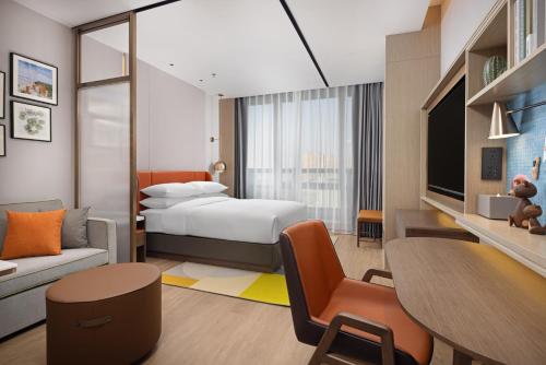 Imagen de la habitación del Hotel Home2 Suite by Hilton Jingjiang Binjiang New Town. Foto 11