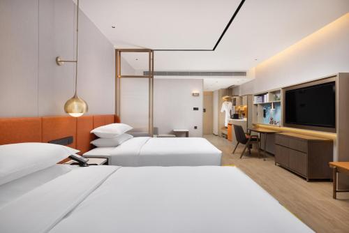 Imagen de la habitación del Hotel Home2 Suite by Hilton Jingjiang Binjiang New Town. Foto 15