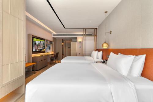 Imagen de la habitación del Hotel Home2 Suite by Hilton Lijiang Ancient Town. Foto 15