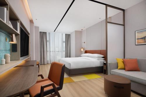 Imagen de la habitación del Hotel Home2 Suite by Hilton Wuhan Economic Development Zone. Foto 15