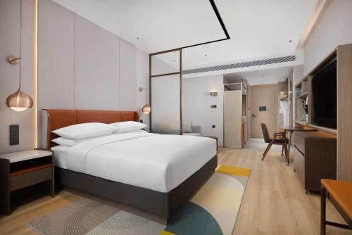 Imagen de la habitación del Hotel Home2 Suite by Hilton Wuhan Economic Development Zone. Foto 16