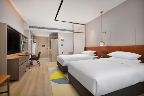 Imagen de la habitación del Hotel Home2 Suite by Hilton Wuhan Economic Development Zone. Foto 17