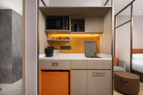 Imagen de la habitación del Hotel Home2 Suite by Hilton Wuhan Economic Development Zone. Foto 18