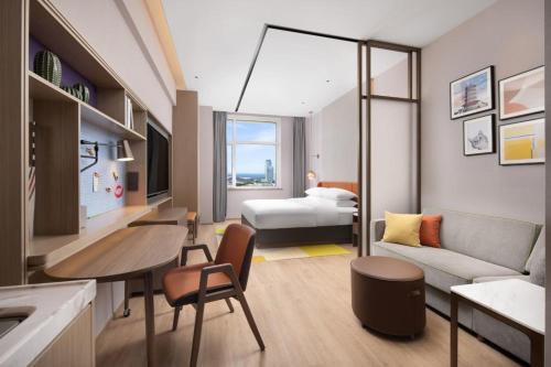 Imagen de la habitación del Hotel Home2 Suite by Hilton Yantai Laishan. Foto 2