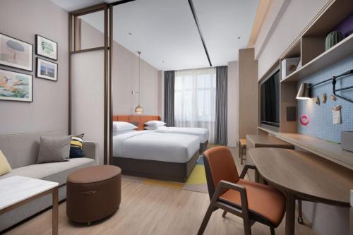 Imagen de la habitación del Hotel Home2 Suite by Hilton Yantai Laishan. Foto 4