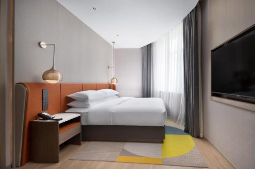 Imagen de la habitación del Hotel Home2 Suite by Hilton Yantai Laishan. Foto 5