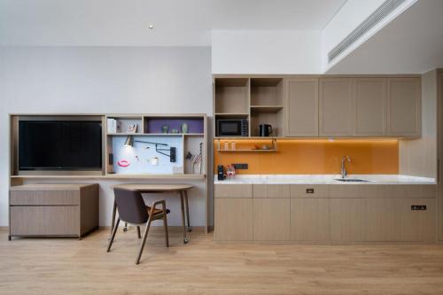 Imagen de la habitación del Hotel Home2 Suite by Hilton Yantai Laishan. Foto 10