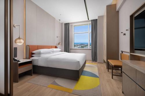 Imagen de la habitación del Hotel Home2 Suite by Hilton Yantai Laishan. Foto 12