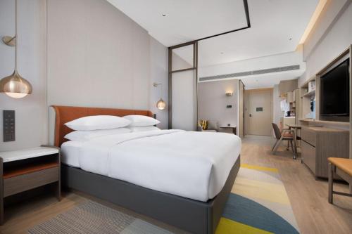 Imagen de la habitación del Hotel Home2 Suite by Hilton Yantai Laishan. Foto 16