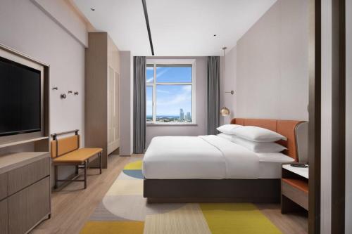 Imagen de la habitación del Hotel Home2 Suite by Hilton Yantai Laishan. Foto 17