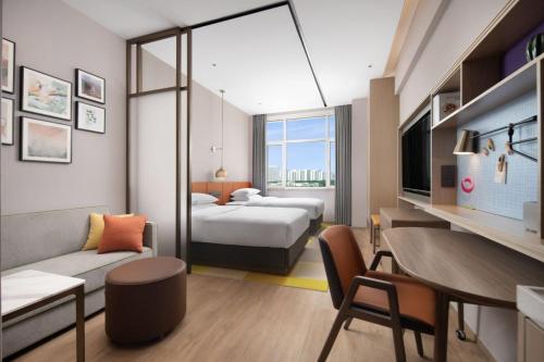 Imagen de la habitación del Hotel Home2 Suite by Hilton Yantai Laishan. Foto 19