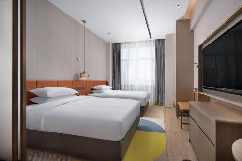 Imagen de la habitación del Hotel Home2 Suite by Hilton Yantai Laishan. Foto 20
