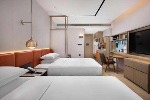 Imagen de la habitación del Hotel Home2 Suite by Meishan Dongpo. Foto 20