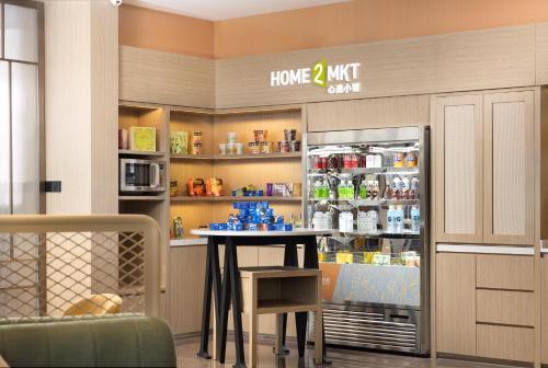 Imagen general del Hotel Home2 Suite by Meishan Dongpo. Foto 13