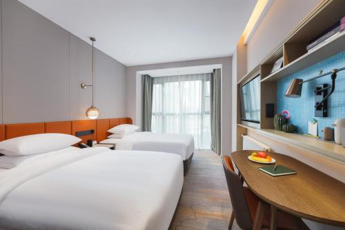 Imagen de la habitación del Hotel Home2 Suites By Hilton Wuhan Hankou Railway Station. Foto 13
