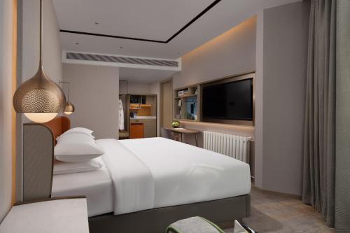 Imagen de la habitación del Hotel Home2 Suites By Hilton Wuhan Hankou Railway Station. Foto 16