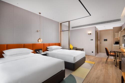 Imagen de la habitación del Hotel Home2 Suites By Hilton Wuhan Xudong. Foto 16