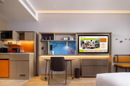 Imagen de la habitación del Hotel Home2 Suites By Hilton Wuhan Xudong. Foto 17