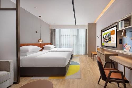 Imagen de la habitación del Hotel Home2 Suites By Hilton Wuhan Xudong. Foto 20