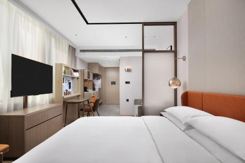 Imagen de la habitación del Hotel Home2 Suites by Hilton Beijing Shunyi. Foto 16