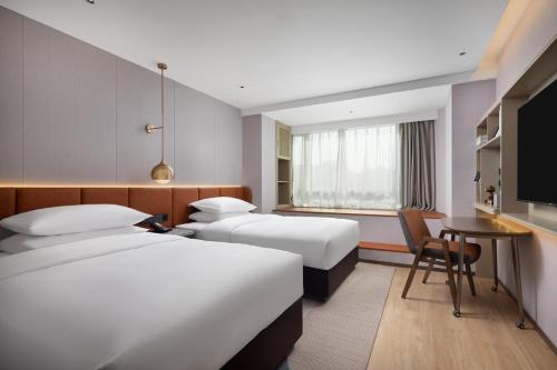 Imagen de la habitación del Hotel Home2 Suites by Hilton Beijing West Station. Foto 2
