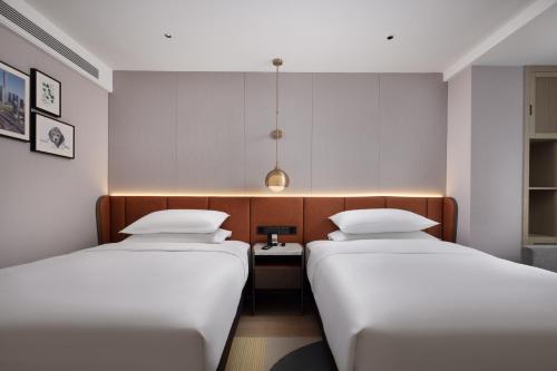 Imagen de la habitación del Hotel Home2 Suites by Hilton Beijing West Station. Foto 5