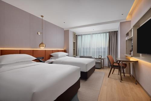 Imagen de la habitación del Hotel Home2 Suites by Hilton Beijing West Station. Foto 6