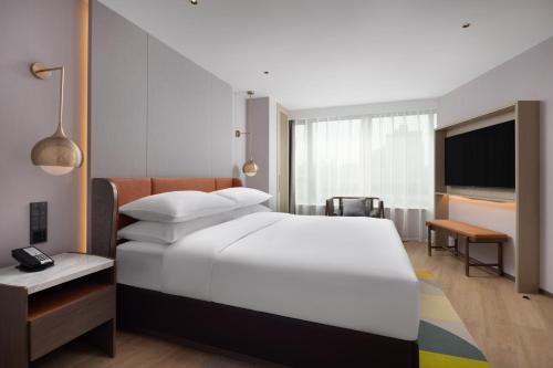 Imagen de la habitación del Hotel Home2 Suites by Hilton Beijing West Station. Foto 17